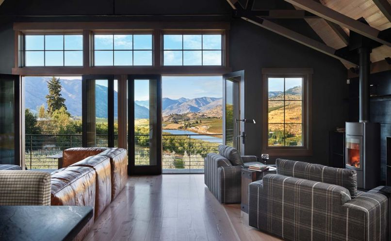 The great room of Tracey and Charlie Brown's barn home opens onto vistas of Lake Chelan. The Stûv wood burning stove warms the great room; 16” to 18” wide Dinesen flooring is fabricated from old growth Douglas fir.