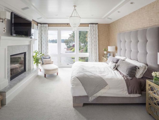The master bedroom features an ensuite fireplace as well as soft, plush detailing to create a sanctuary-like atmosphere.