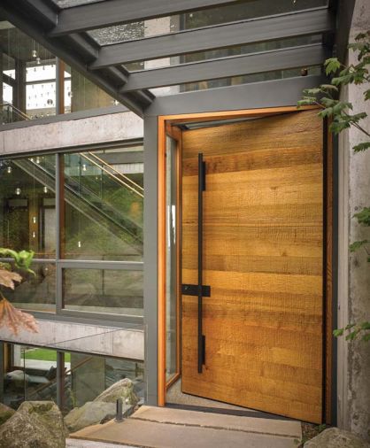 Drawing inspiration from the human history of the Bellingham area, McClellan selected a cedar slab textured with a hand adze, a traditional Native American carpentry tool, for the front door.