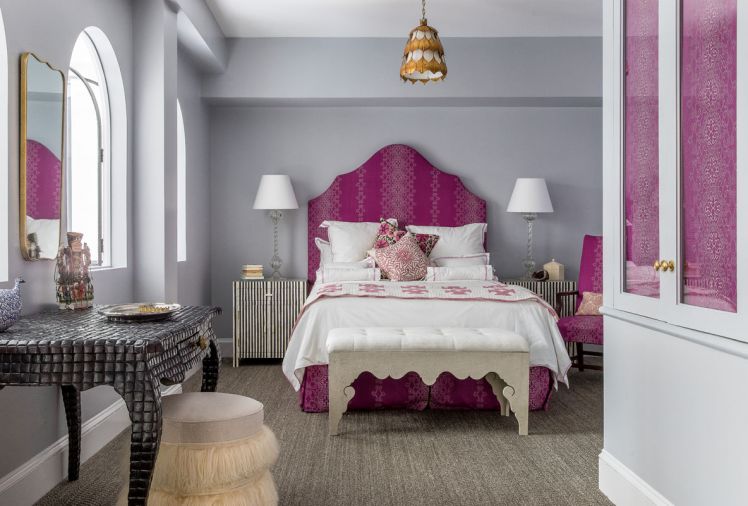 Howe adds brilliant color to the master bedroom, while echoing her client’s love for Indian textiles with a Lisa Fine fabric for headboard and bed skirt.