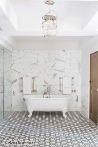 Master bath features handcrafted New Ravenna floor tiles and marble backsplash via Ann Sacks.