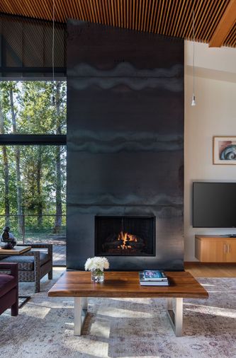 Miller glued hot-rolled steel plates to plywood to form the fireplace.