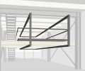 Architects’ drawing of a continuous multi-function steel frame threaded through center of the space, which serves as an organizing element for plan, structural element for the expanded mezzanine, and support structure for barn doors.