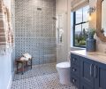 The guest bath’s swath of Italian tile is a traditional pattern but done boldly and dynamically, flowing from ceiling to wall. In both spaces, O’Brien always looks to balance straight and curved lines. Entering both these rooms evokes a feeling of vacationing in your own home.