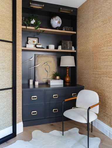 Diana’s office is behind a glass door from Pinkies Iron Doors. The woven palm leaf wall covering is by Thibaut, with custom cabinetry designed by Charla Ray and built by Rockwood Cabinetry.