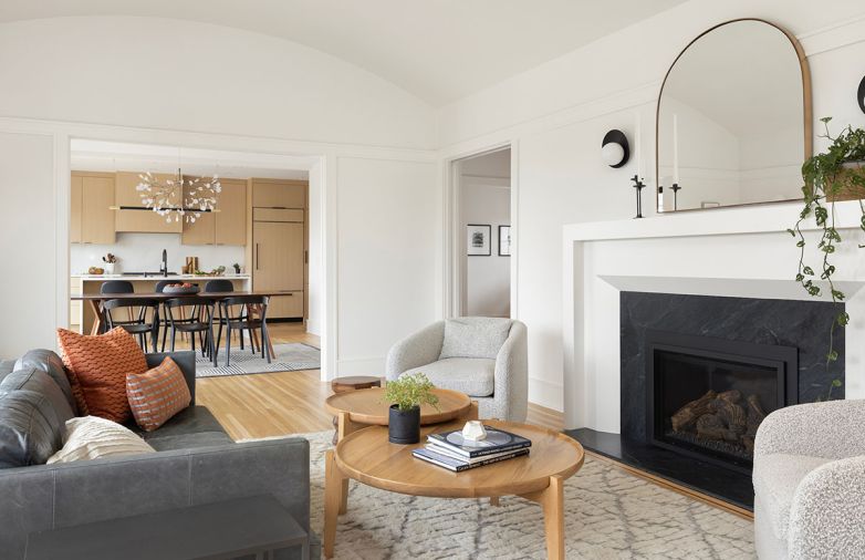 “Annie is really good at designing toward what works best in a home, whether it’s traditional or modern, or both,” says Celtnieks. Living room furnishings were sourced from West Elm, Rejuvenation, and Burke Decor, with Pearl sconces from Cedar and Moss.