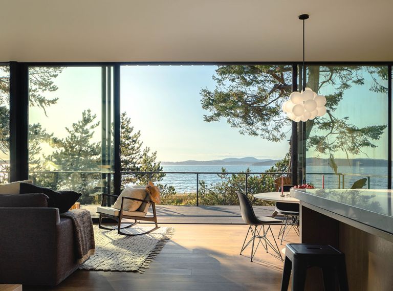 The most stunning feature of this modern home is the wall of Fleetwood sliding glass doors from Cherry Creek Windows & Doors, providing an unfettered view of the Salish Sea.