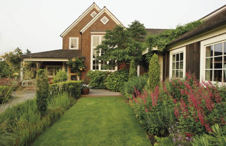 Using an easy-care palette of plants selected for texture, Michael was also able to direct guest traffic around the exterior spaces, linking decks, porches, and arbors to lure visitors from one area to another.
