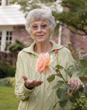 Susan Bates displays her favorite Rose, ‘Just Joey.’
