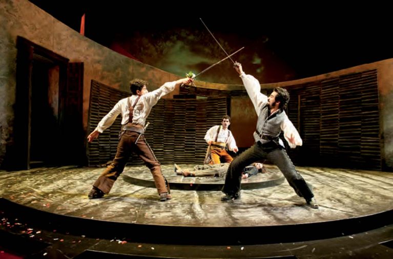 Romeo (Daniel José Molina) and Tybalt (Fajer Al-Kaisi) fight for the honor of their families as Benvolio (Kevin Fugaro) watches over the fallen Mercutio (Jason Rojas) in <em>Romeo and Juliet</em>, part of Oregon Shakespeare Festival’s live theatre lineup.