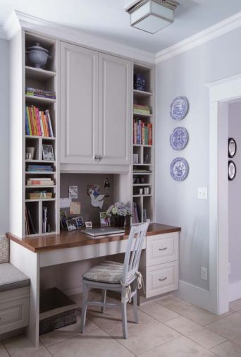 A built-in kitchen desk takes up less room than the stand alone type, and can provide easy-to-reach storage for colorful cookbooks, planners and office work.