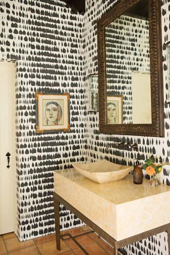 Schumacher's Queen of Spain wallcovering adds graphic glory to the powder room, with Alpha Stoneworks counter and Gearhart Ironwerks stand.