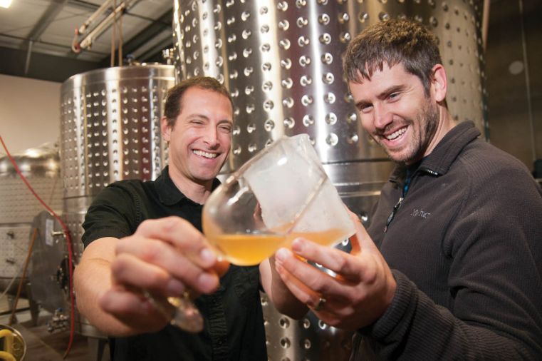 Nick Gunn and James Kohn toast to the continued success of Wandering Aengus. Though their ciders never contain any artificial additives or flavors, Wandering Aengus is continually experimenting with new ciders made by blending apples with other fruits, herbs, or spices.