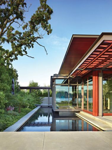 The north end of the Pavilion House cantilevers over a reflecting pool and a lush paradise garden for spring and summer viewing enjoyment. Landscape architecture by Charles Anderson.