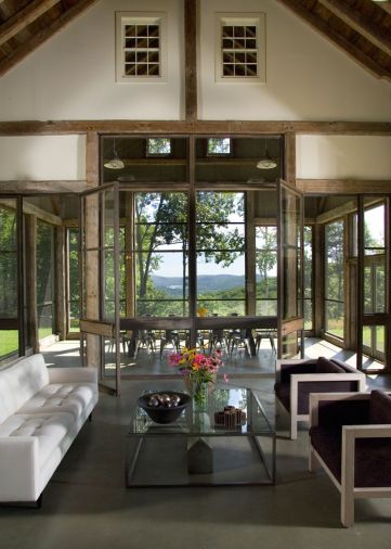 Steel and glass doors open up the barn on three sides to reveal stunning vistas