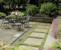 The intersection of a garden’s hardscaping with its plantings can look like a train wreck, or it can be as smooth and seamless as Michael Schultz’s soft harmony of low wall with enthusiastic hardy geraniums peering down at bluestone pavers mortared together with the New Zealand groundcover known as brass buttons. This stalwart, flat spreading plant will easily tolerate some foot traffic.