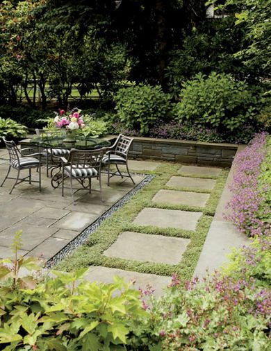 The intersection of a garden’s hardscaping with its plantings can look like a train wreck, or it can be as smooth and seamless as Michael Schultz’s soft harmony of low wall with enthusiastic hardy geraniums peering down at bluestone pavers mortared together with the New Zealand groundcover known as brass buttons. This stalwart, flat spreading plant will easily tolerate some foot traffic.
