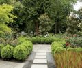 The garden’s pathways are permeable to mollify drainage problems, and are composed of mixed media, here bluestone pavers and quarter-minus gravel, to make them rhythmic and efficient without drawing attention away from the plants. A metal edging called “flat bar” keeps the path edges tidy and easy to maintain.