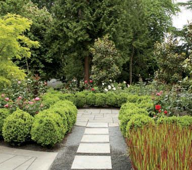 The garden’s pathways are permeable to mollify drainage problems, and are composed of mixed media, here bluestone pavers and quarter-minus gravel, to make them rhythmic and efficient without drawing attention away from the plants. A metal edging called “flat bar” keeps the path edges tidy and easy to maintain.