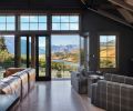 The great room of Tracey and Charlie Brown s barn home opens onto vistas of Lake Chelan. The Stûv wood burning stove warms the great room; 16” to 18” wide Dinesen flooring is fabricated from old growth Douglas fir.