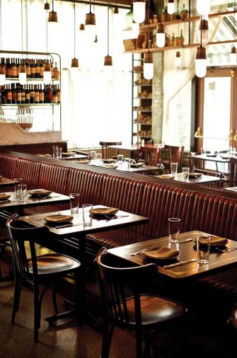 The dining room is bisected by a leather-coated banquette that runs nearly the entire length of the restaurant.