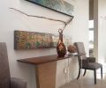 For this home, meant to appeal to a wide variety of residents, Ewan chose a polished yet soft mid-century aesthetic that pairs a touch of rusticity with a contemporary feel.