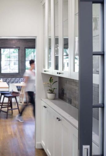 The original interior French doors were repurposed as pocket doors.