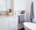 The master bath features a freestanding bath by Victoria & Albert.