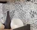 A jaunty Hygge & West modern wallpaper adds zest to the room. The shelf and brackets are from Quartertwenty.