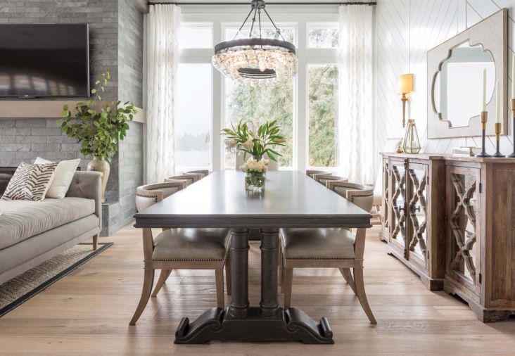 The dining room prominently features geometric motifs with vertical axes of symmetry, including a custom-installed chevron wall that gives a contemporary nod to bead board, a classic adornment to many coastal New England homes. The furnishings in this home were sourced from a wide range of vendors: “I look everywhere!” says Baines. “I don’t like things to match, so I scour all the resources we can find.”