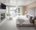 The master bedroom features an ensuite fireplace as well as soft, plush detailing to create a sanctuary-like atmosphere.