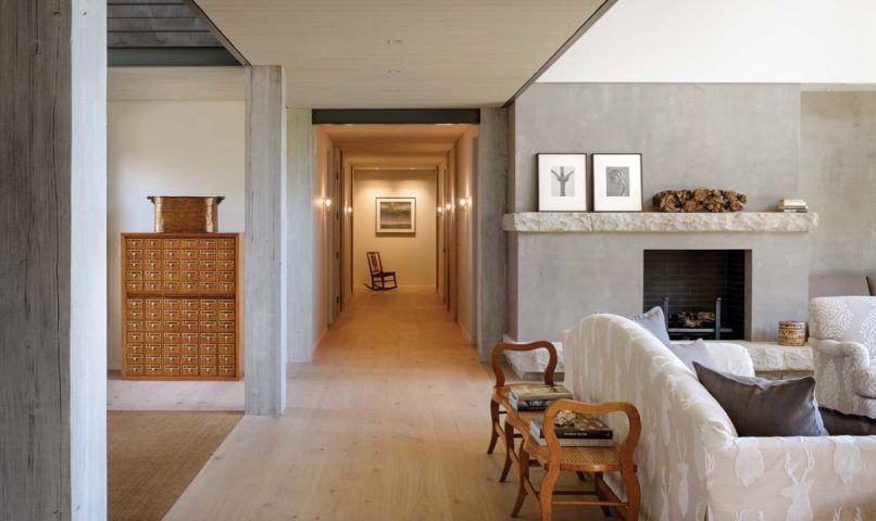 “The fireplace and seating alcove present themselves horizontally,” says Tim Hossner of RHO Architects, “as part of our larger design strategy of trying to reframe the feeling of these once cavernous spaces.”