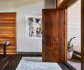 Collin wanted the first “handshake” of the home to be the hand-hewn handle on the Alder door. A warm cedar wall bumps up against the darker prefinished Siberian Oak Provenza flooring.