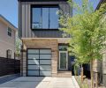 The receded garage presents a modest street view.