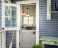 Split side door to the kitchen hearkens back to European farmhouses, complete with porch potager.