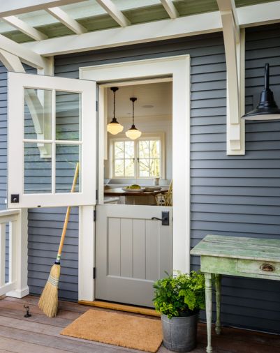 Split side door to the kitchen hearkens back to European farmhouses, complete with porch potager.