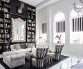 Howe’s custom bench done in marbleized silk by Claremont faces off with a pair of French chairs reupholstered in gray wool and juxtaposed against a spritely hoofed side table.