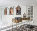 A 1970s Italian brass desk occupies the balcony, where a staircase to the rooftop was originally 
envisioned to reside. A West Elm rug, and Visual Comfort brass light fixture were temporary.