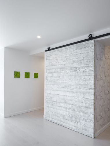 The barn door features reclaimed shoji wood.