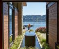 A watercourse and sculpture greets visitors as they enter the home, bringing the water element from the lake right up to the structure.