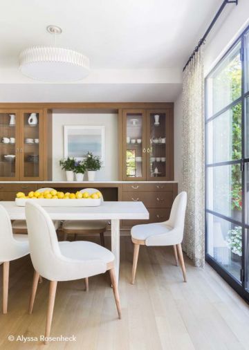 A beloved fir tree on the property is memorialized in the custom table. Taylor Anne Interiors custom chairs finish the look.