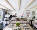 A daybed upholstered in Mark Alexander velvet draws the eye toward the water. A baby grand piano is an eye-catching and sonorous addition to the living room. Coffee table from Formations Antiques. Velvet sofa pillows by de Le Cuona; sofa fabric Jean de Merry.