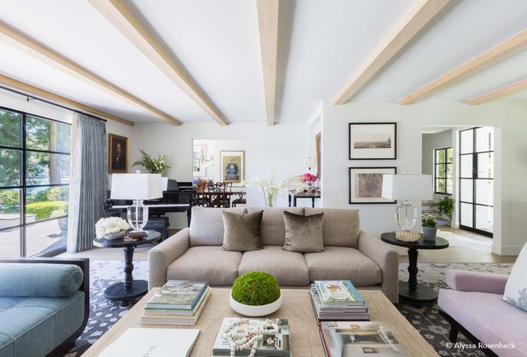 A daybed upholstered in Mark Alexander velvet draws the eye toward the water. A baby grand piano is an eye-catching and sonorous addition to the living room. Coffee table from Formations Antiques. Velvet sofa pillows by de Le Cuona; sofa fabric Jean de Merry.