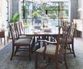 To bring the homeowners’ traditional dining room set up-to-date, Ogle reupholstered the chairs by replacing the former classic stripe with a new fabric from Fret Fabrics, a NYC luxury design house. Chandelier by Jean de Merry. Blue/green rug from Mansour Modern Strie02 adds texture and movement to the room.