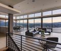 A horizontal cloud was added as an architectural feature to counteract the tall vaults at the main living area/entry, where a bridge connects the upper guest parking area with the living room, and the spectacular view of Mt. Hood beyond.