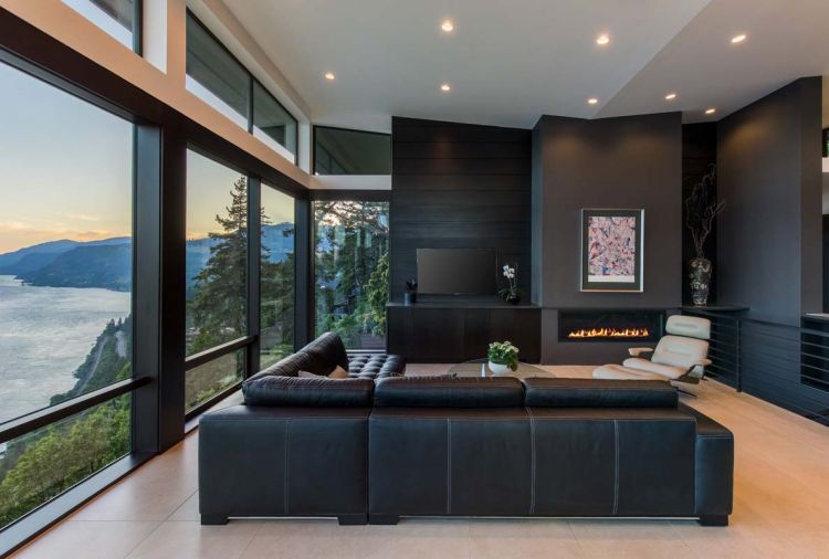 A Roche Bobois Athea armchair cozies up to the fireplace, sharing the ample space with the homeowners’ large leather W. Schillig sectional.