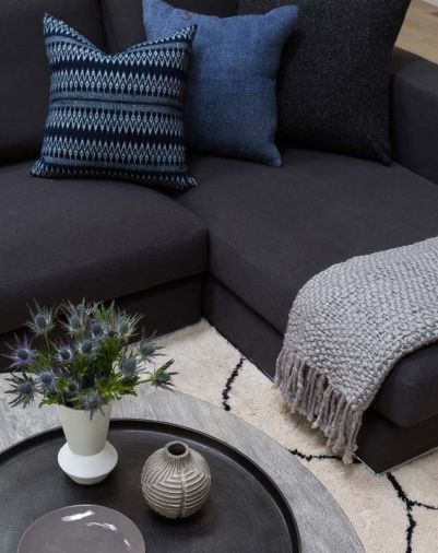 Accessories like the pillows from Tasdemir Rugs on Bainbridge Island help add texture to the living room.