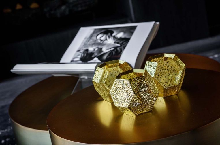 Tom Dixon gold candle holders cast fascinating golden light adding intimacy to late night conversations.