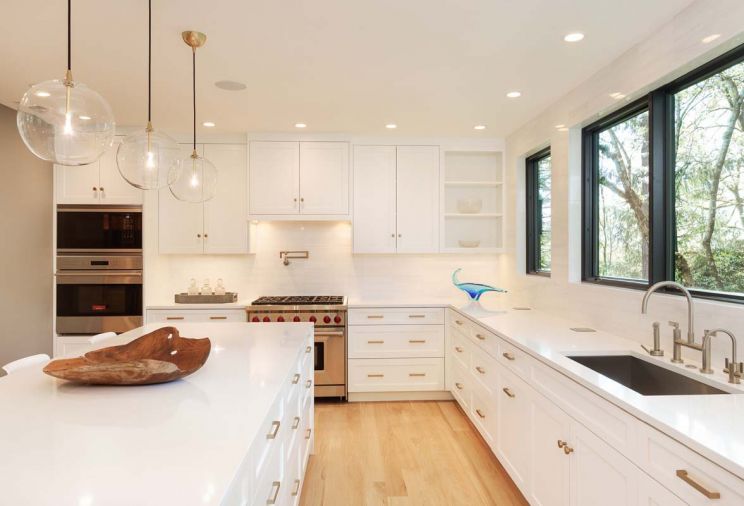 Kitchen backspalsh is Snow White 3'x12' polished marble from Turkey sourced through Intrepid Marble & Granite. Countertops in Absolute White Quartz. Cabinets designed by Benjamin Silver. Sub-Zero 36-inch Integrated Refrigerator, Wolf 36-inch Six Burner Gas Range, Wolf 30' Electric/Convection Wall Oven, Wolf 30' Convection Microwave, Wolf Warming Drawer, Miele Crystal Fully Integrated Dishwasher, all from BASCO Appliances. Watermark faucets. Live sawn White Oak with Bona Heavy Traffic Flat Finish floors from Castle Bespoke Flooring.