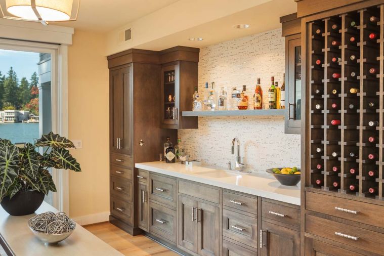 Oak Grove Cabinets pop against a Porcelanosa Lines Mini Strip Grey tile backsplash.